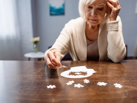 woman completing a puzzle